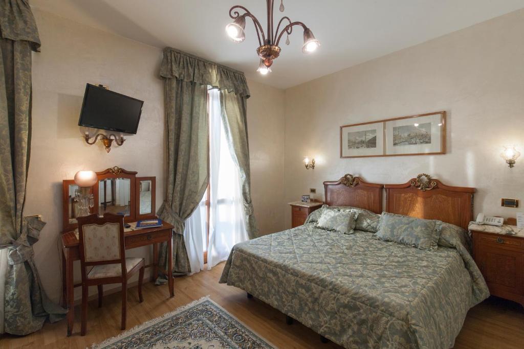 Postel nebo postele na pokoji v ubytování Hotel Riviera Venezia Lido