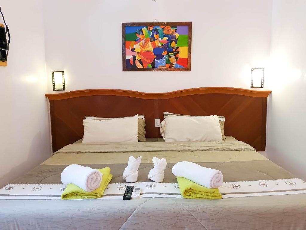 Postel nebo postele na pokoji v ubytování Cocoloco Beach Resort