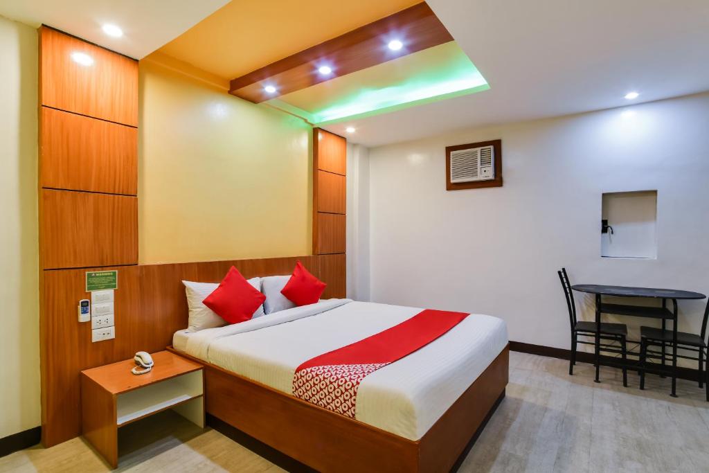 Ένα ή περισσότερα κρεβάτια σε δωμάτιο στο OYO 473 Ranchotel Drive-in