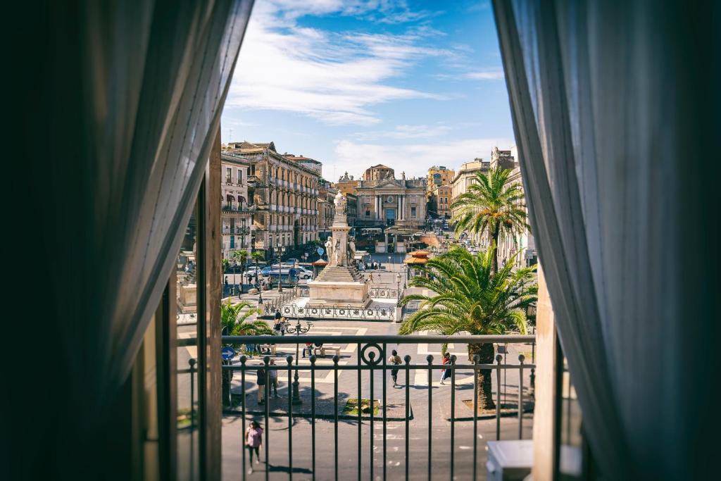 a view of a city from a window at FANNY B&B in Catania