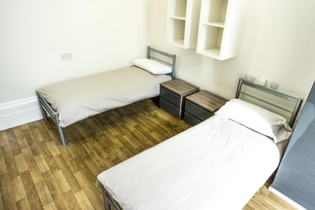 Postel nebo postele na pokoji v ubytování Sandeman-Allen Hostel (Bayswater)