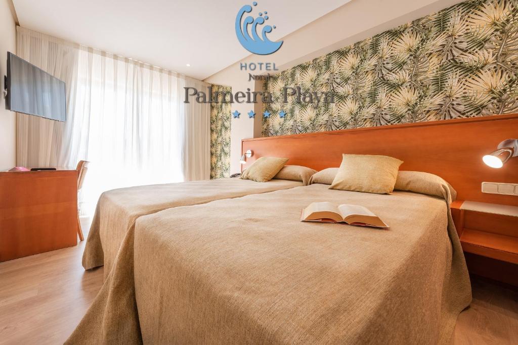 Posteľ alebo postele v izbe v ubytovaní Hotel Norat Palmeira Playa