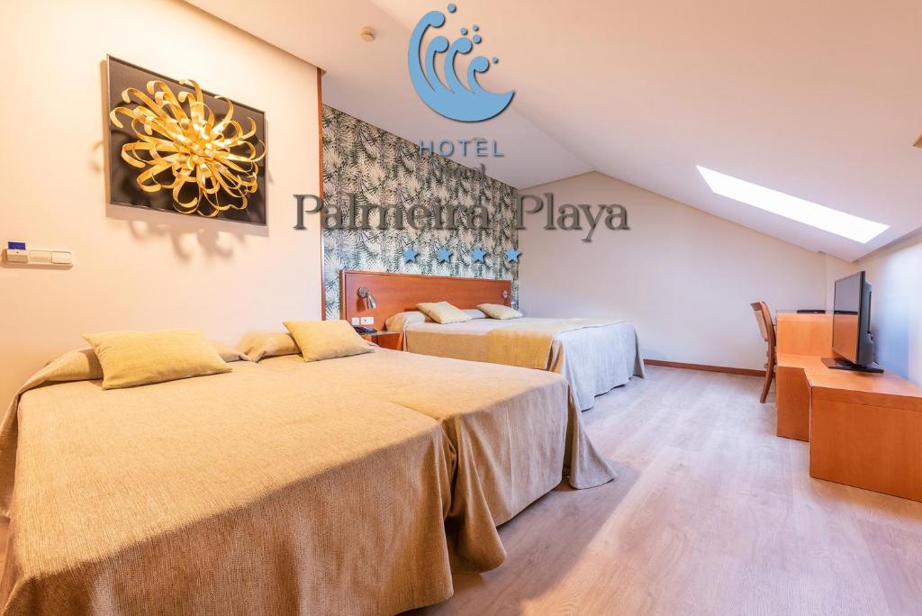 Posteľ alebo postele v izbe v ubytovaní Hotel Norat Palmeira Playa