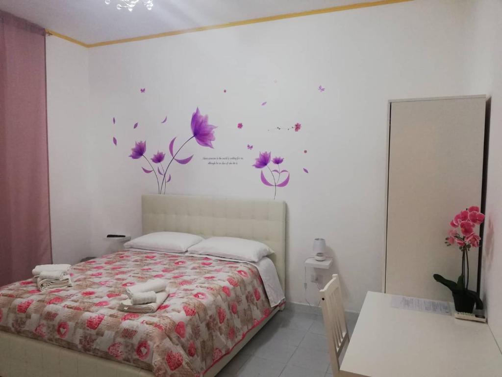 Una cama o camas en una habitación de Le tre orchidee