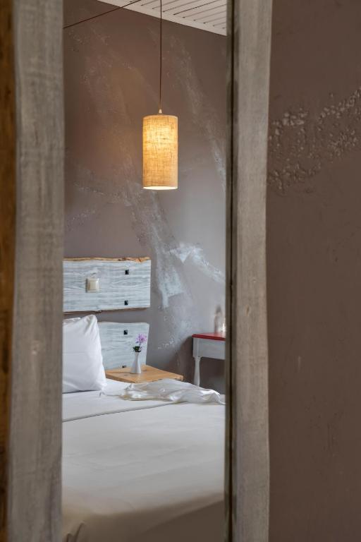 Postel nebo postele na pokoji v ubytování Kastalia Boutique Hotel