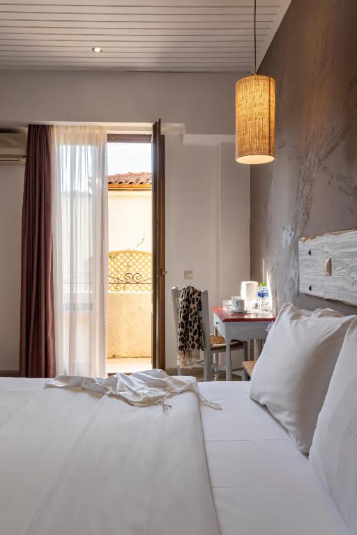 Postel nebo postele na pokoji v ubytování Kastalia Boutique Hotel