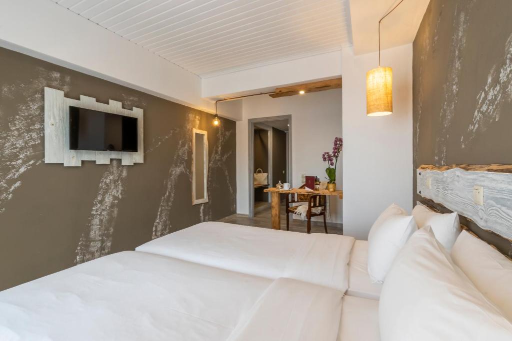 Postel nebo postele na pokoji v ubytování Kastalia Boutique Hotel