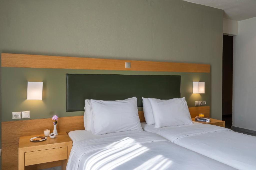 Postel nebo postele na pokoji v ubytování Kastalia Boutique Hotel