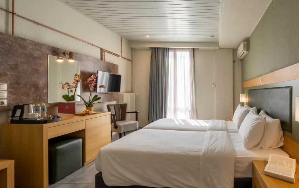 Postel nebo postele na pokoji v ubytování Kastalia Boutique Hotel