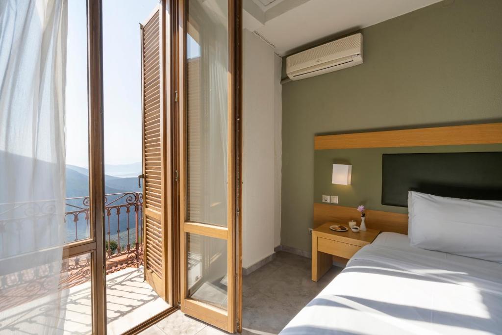 Postel nebo postele na pokoji v ubytování Kastalia Boutique Hotel