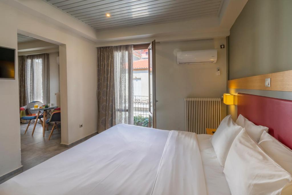 Postel nebo postele na pokoji v ubytování Kastalia Boutique Hotel