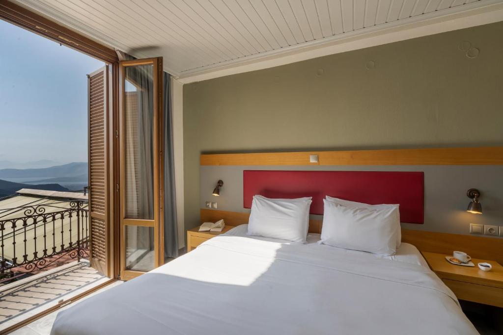 Postel nebo postele na pokoji v ubytování Kastalia Boutique Hotel