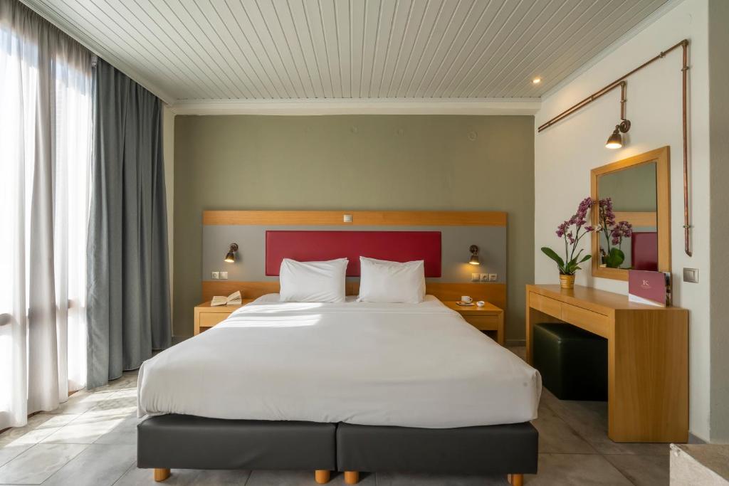 Postel nebo postele na pokoji v ubytování Kastalia Boutique Hotel