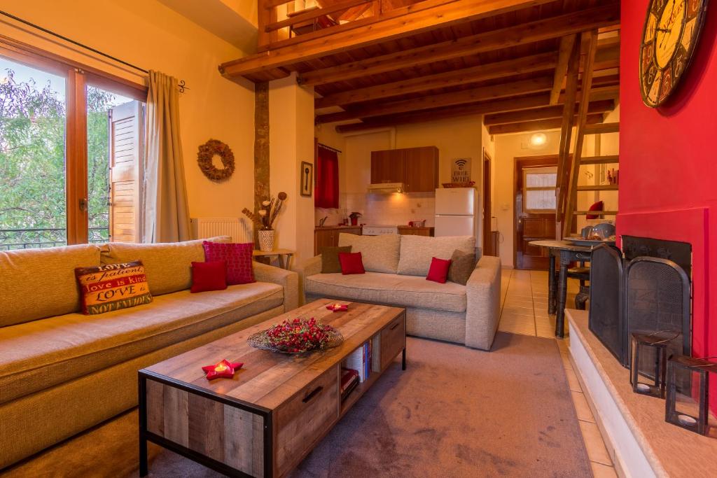 a living room with a couch and a coffee table at Katsarou Apartments in Arachova