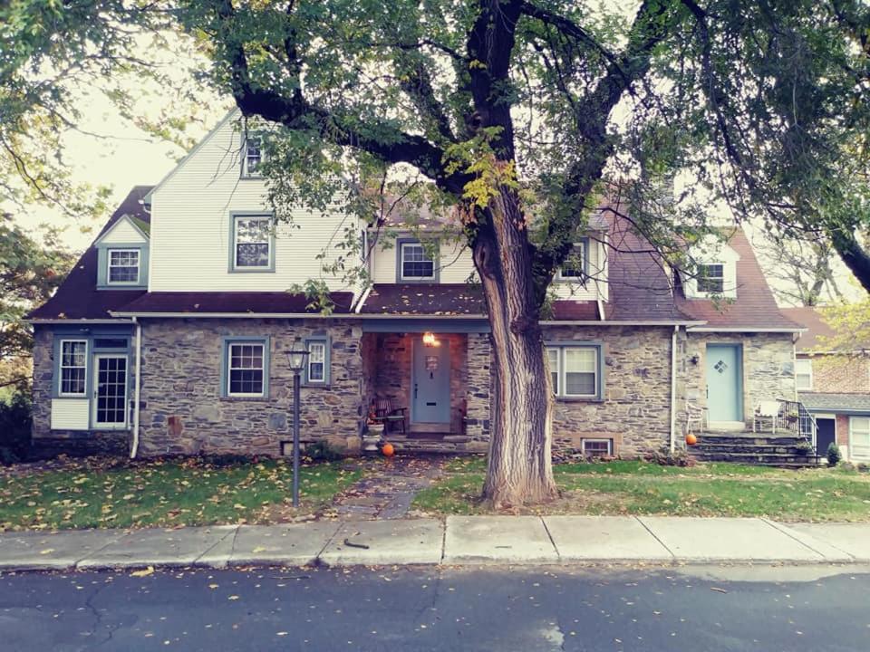 a brick house with a tree in front of it at Sleepy Hollow Manor in Gettysburg