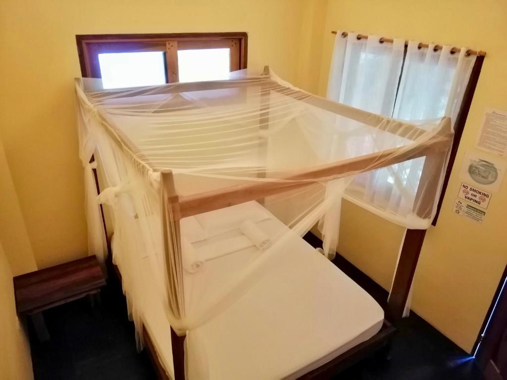 Postel nebo postele na pokoji v ubytování Ilakai Hostel