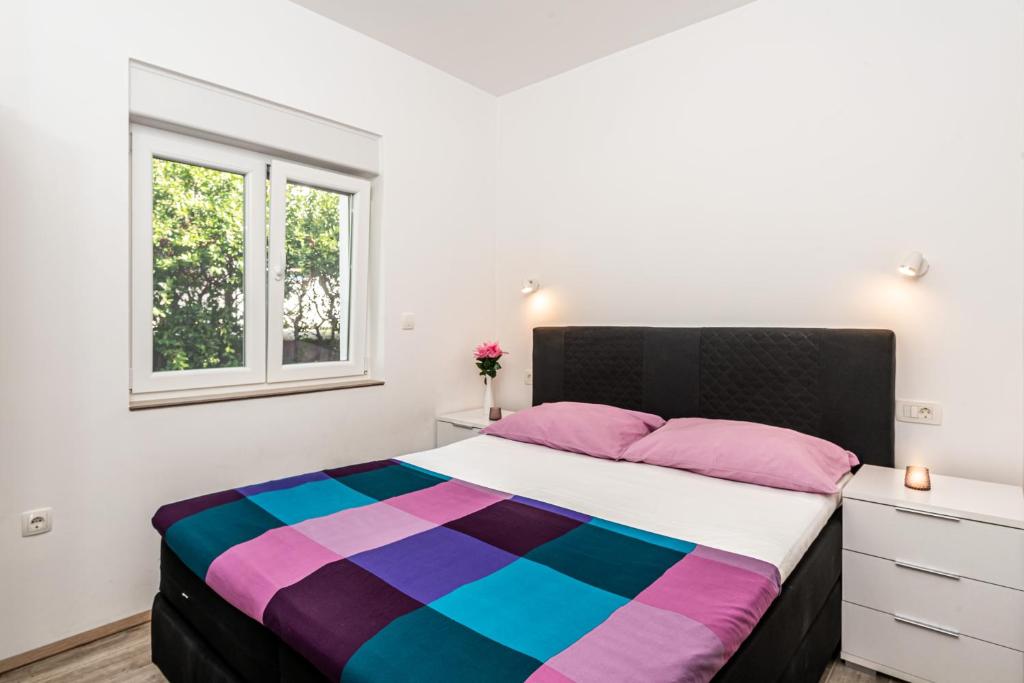 Postel nebo postele na pokoji v ubytování Apartment Nino