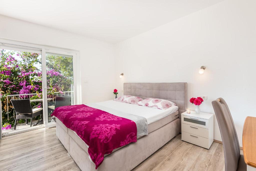 Postel nebo postele na pokoji v ubytování Apartment Nino