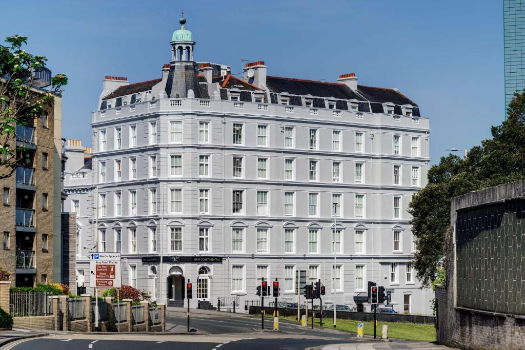 a large white building on a city street at New Continental Hotel; Sure Hotel Collection by Best Western in Plymouth