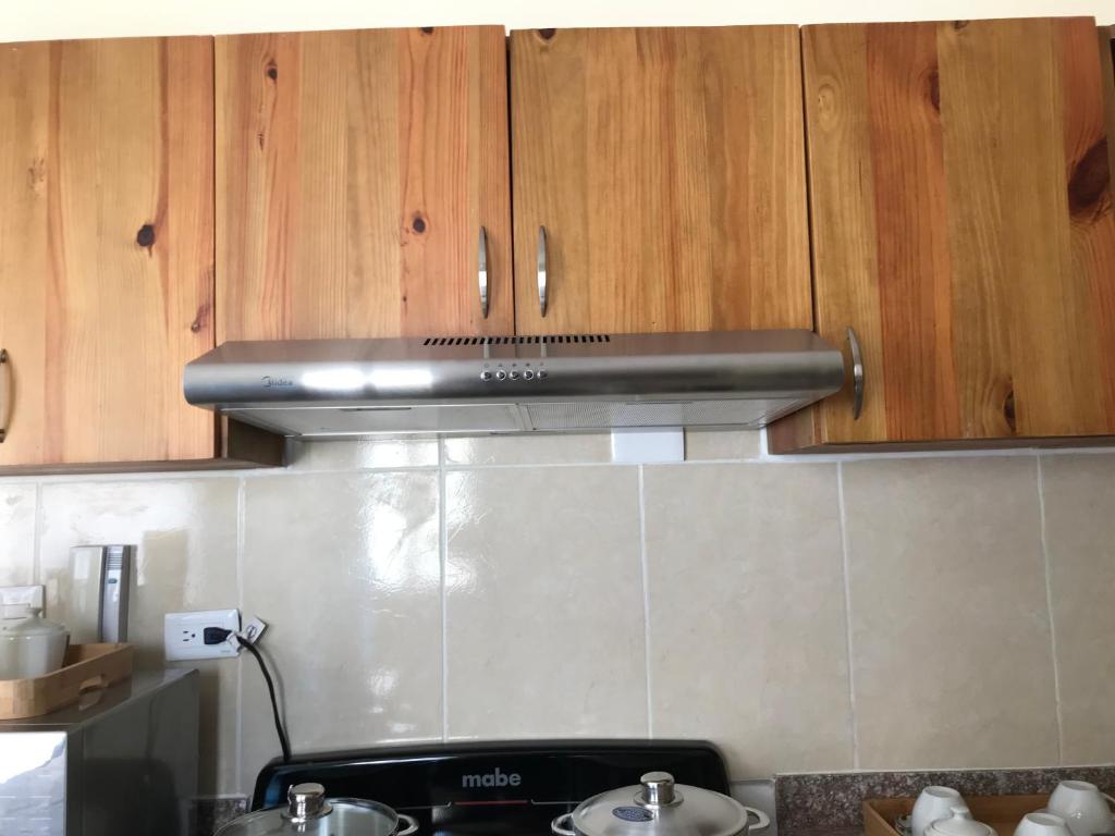 Kuchyň nebo kuchyňský kout v ubytování cómodo first floor