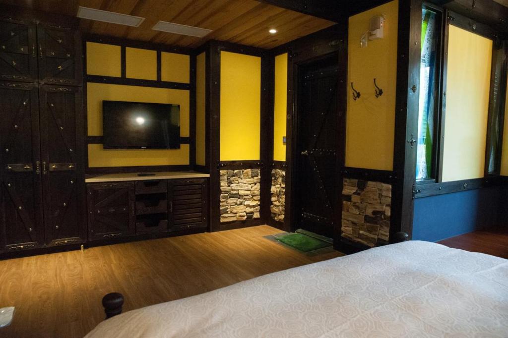 Postel nebo postele na pokoji v ubytování Youngquan HOTEL