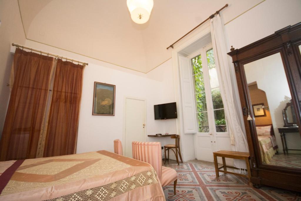 TV a/nebo společenská místnost v ubytování Palazzo Rollo