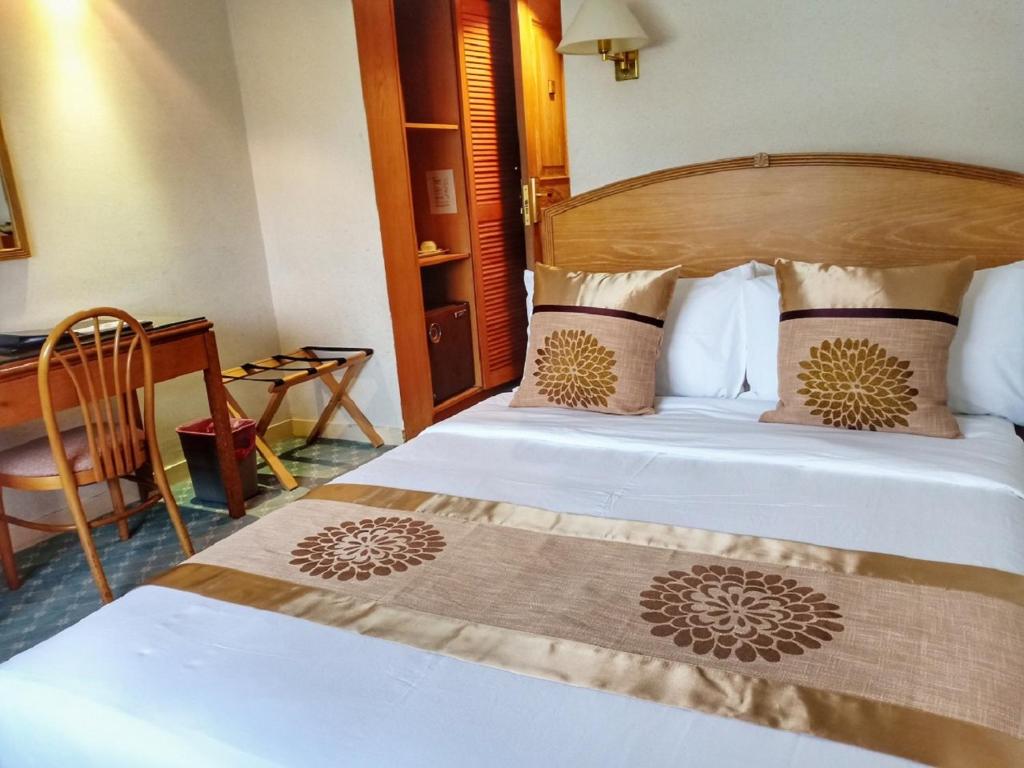 Postel nebo postele na pokoji v ubytování Terrace Hotel