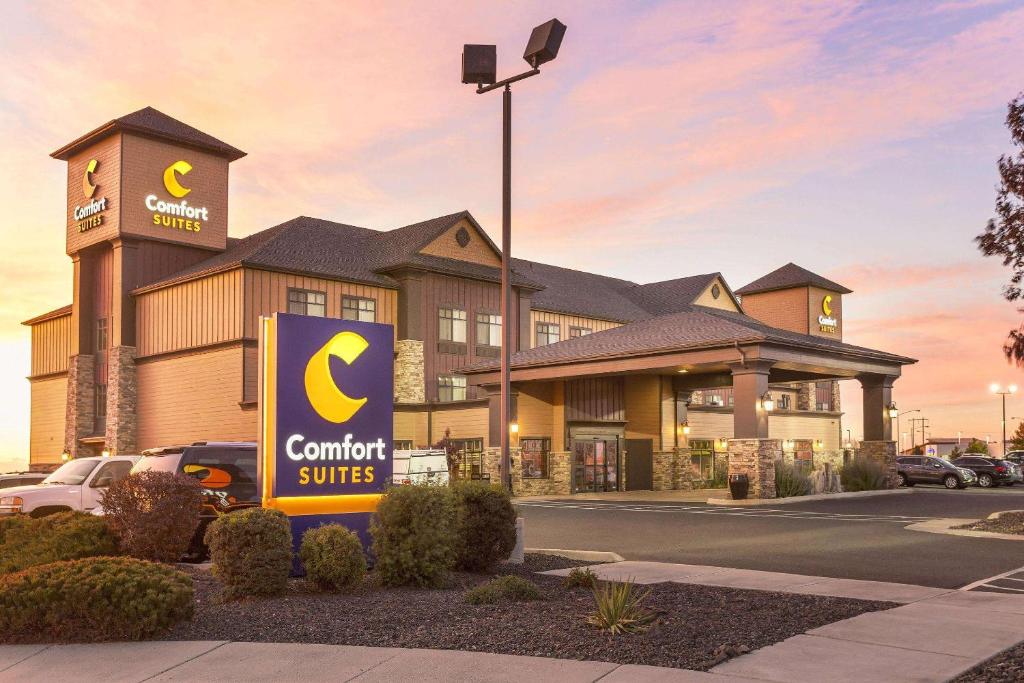 a commercial building with a sign in front of it at Comfort Suites Moses Lake in Moses Lake