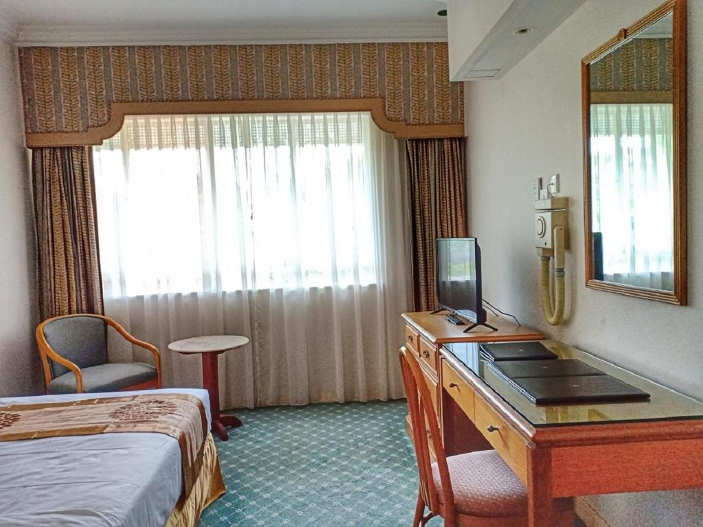 Postel nebo postele na pokoji v ubytování Terrace Hotel