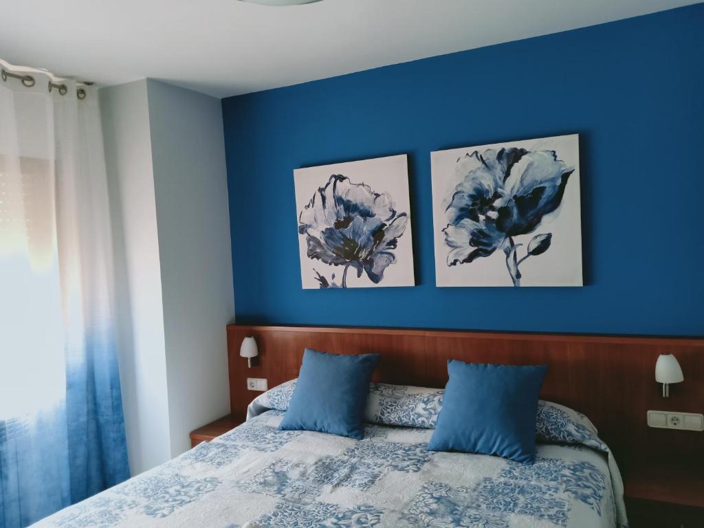 Postel nebo postele na pokoji v ubytování Hostal Casa Barranco