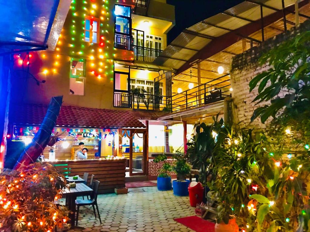 a restaurant with christmas lights and christmas trees at Hotel The Doors in Kathmandu