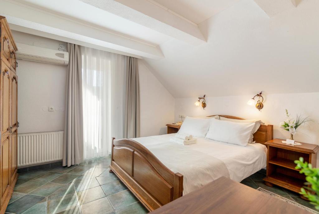 Postel nebo postele na pokoji v ubytování Jagodic Garni Hotel