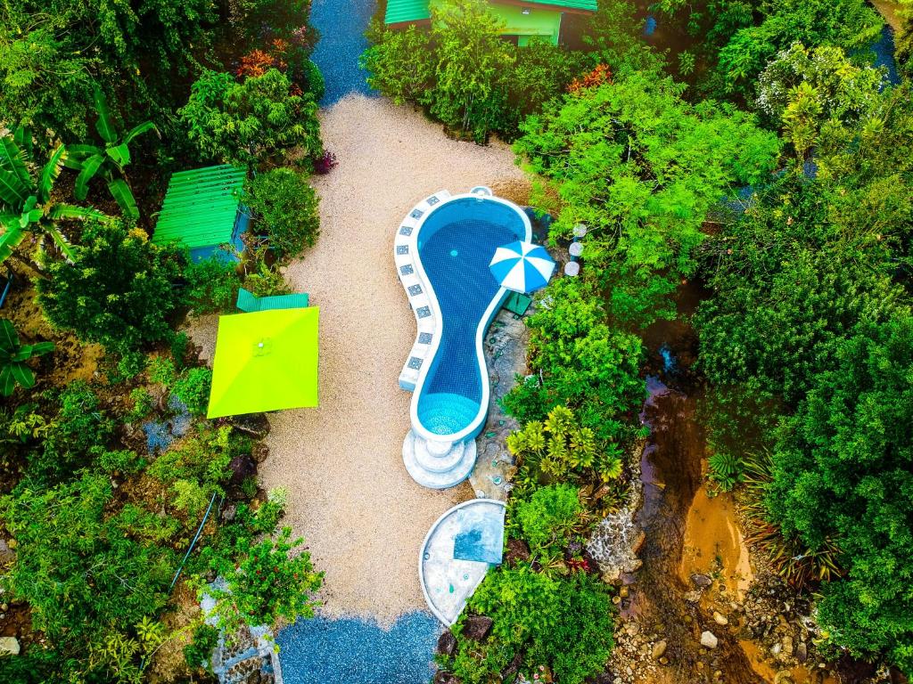 an aerial view of a water park with an umbrella at The Mouth Resort - SHA Extra Plus in Khao Lak