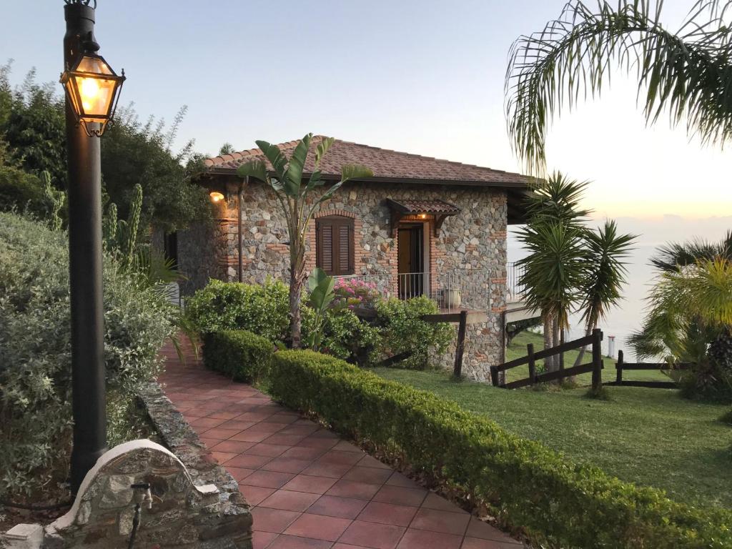 a stone house with a street light in front of it at Villa Laura in Coccorino