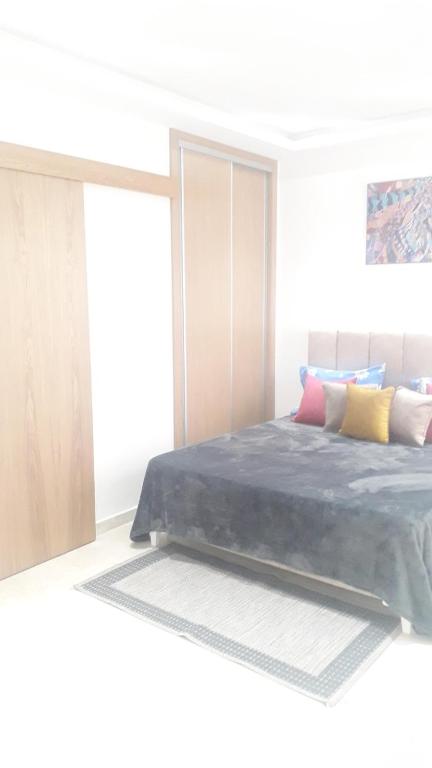 Postel nebo postele na pokoji v ubytování Appartement à La Marsa