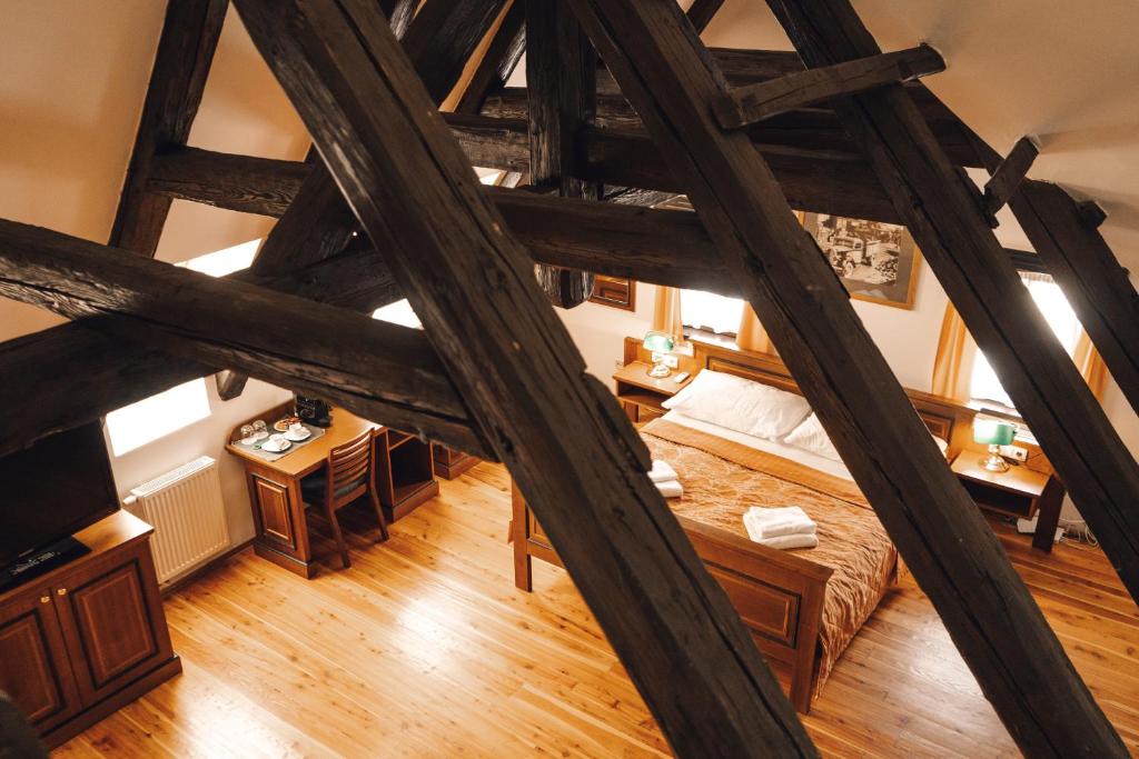 Postel nebo postele na pokoji v ubytování U Medvidku-Brewery Hotel