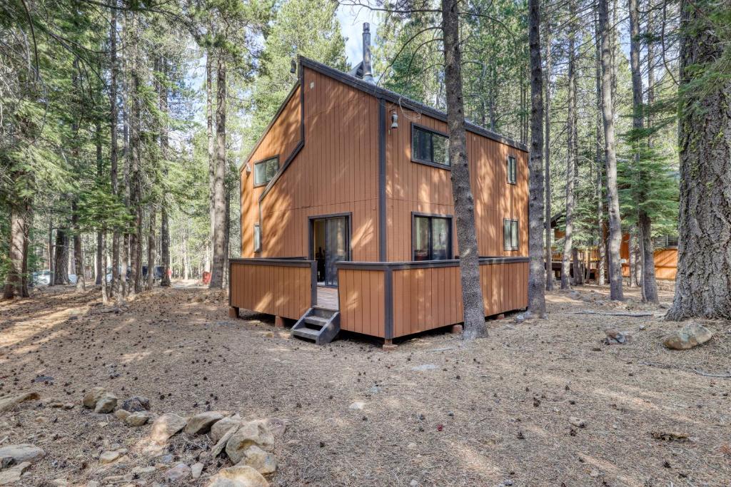 a tiny house in the woods in the forest at Cozy Davos Cabin in Truckee