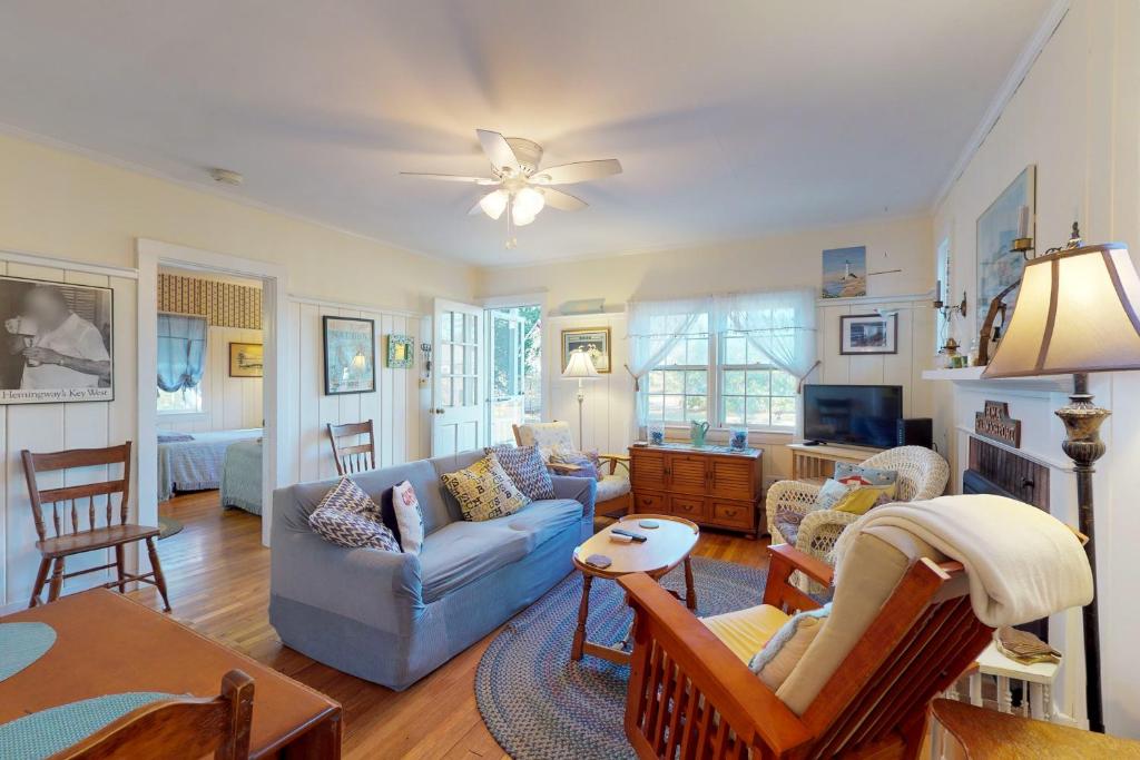 a living room with a couch and a table at The Spray in Harwich Port