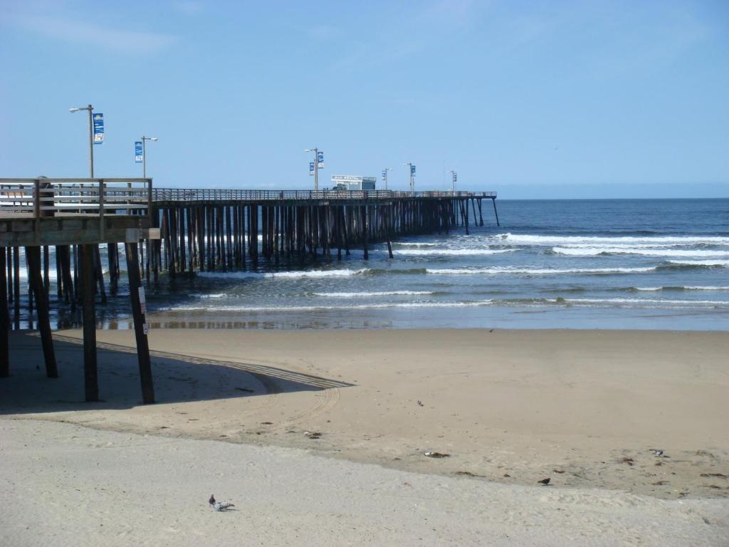 a beach with a pier and the ocean at Holiday Inn Express Grover Beach-Pismo Beach Area by IHG in Grover Beach