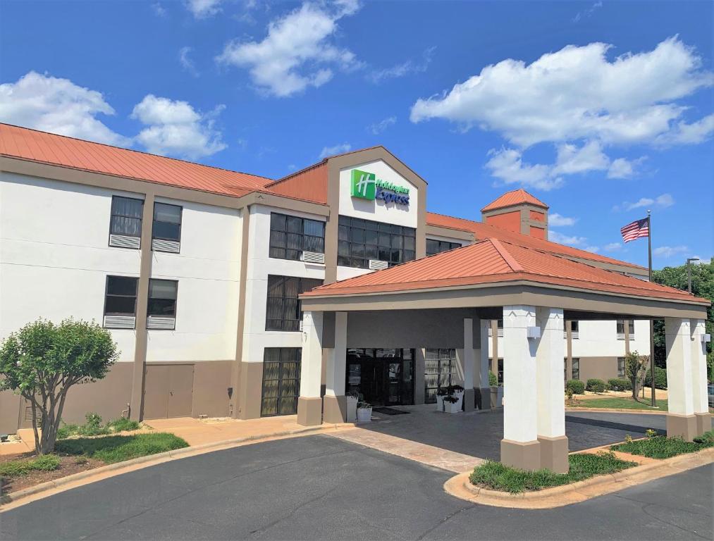 a hotel with a sign on the front of it at Holiday Inn Express Hillsborough-Durham Area, an IHG Hotel in Hillsborough