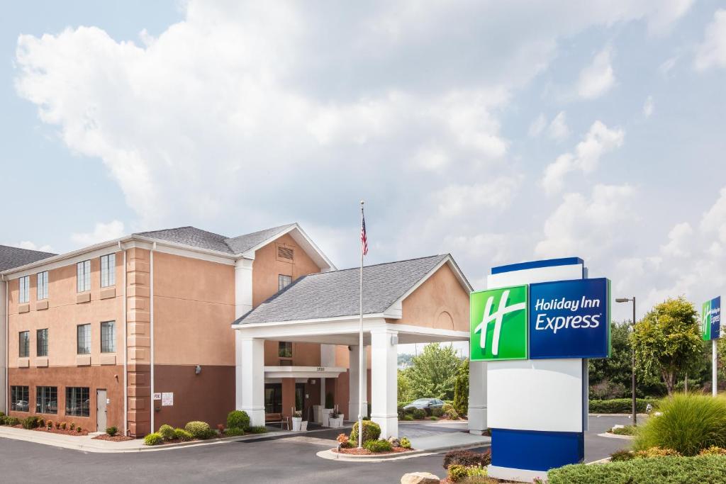 a hotel with a sign in front of a building at Holiday Inn Express Winston-Salem, an IHG Hotel in Winston-Salem