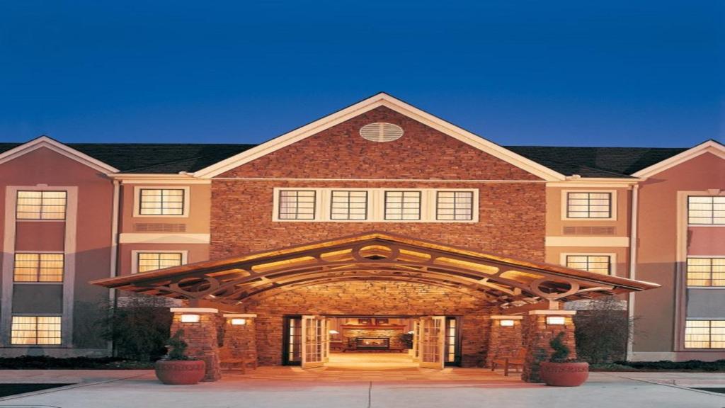 a large brick building with an archway at Staybridge Suites - Johnson City, an IHG Hotel in Johnson City