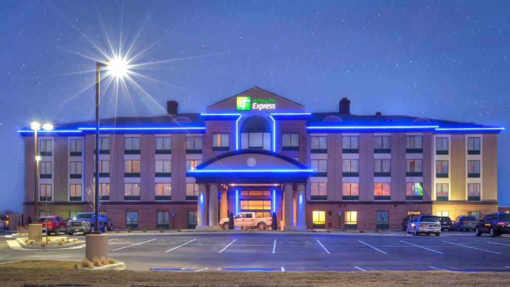 a hotel with a parking lot in front of it at Holiday Inn Express Wichita South, an IHG Hotel in Wichita
