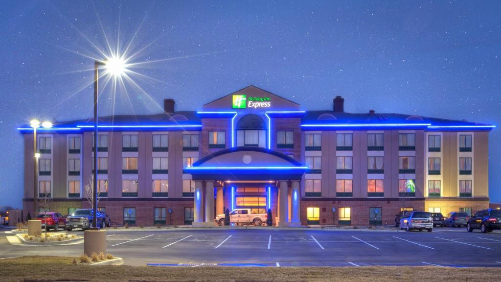 a hotel with a parking lot in front of it at Holiday Inn Express Wichita South by IHG in Wichita