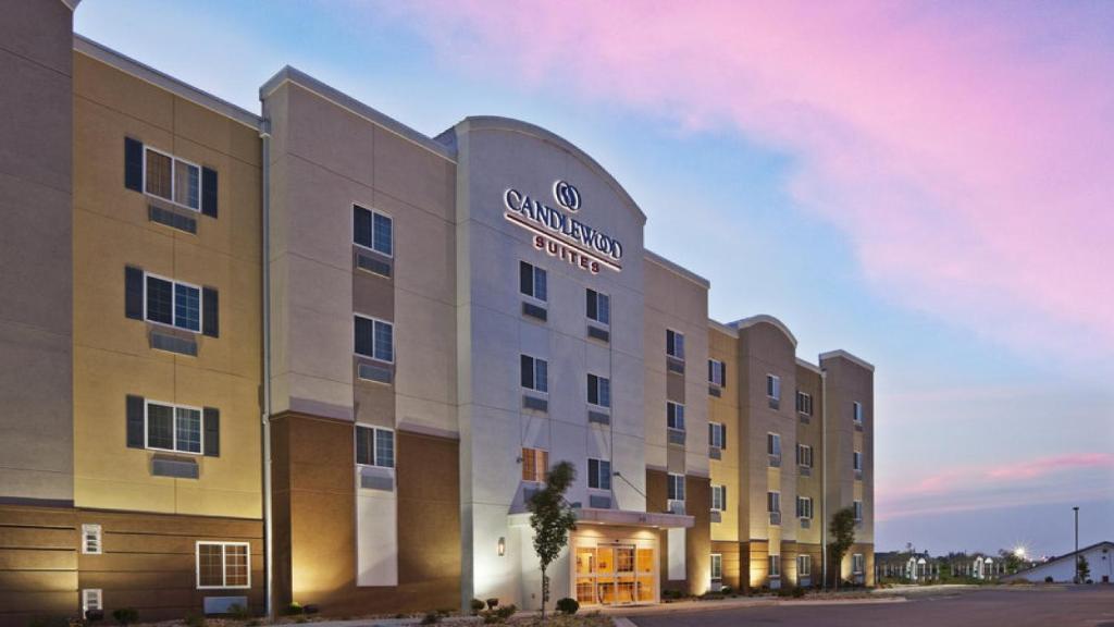 a rendering of a hotel with a sign on it at Candlewood Suites Midland, an IHG Hotel in Midland