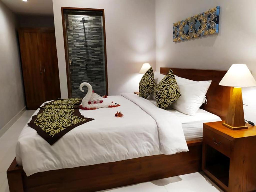 Postel nebo postele na pokoji v ubytování BatanTop Ubud guest house