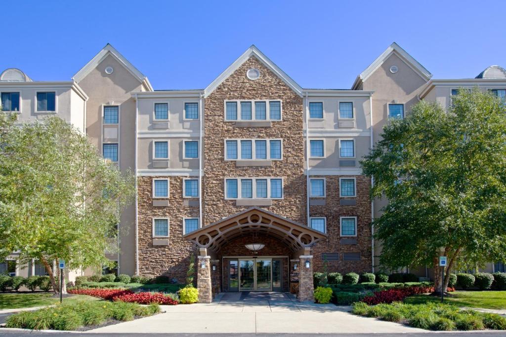a large brick building with an entry way at Staybridge Suites Indianapolis-Fishers, an IHG Hotel in Fishers