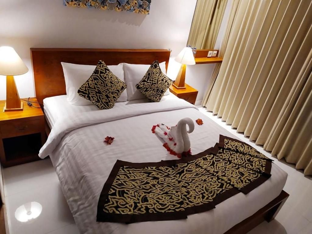 Postel nebo postele na pokoji v ubytování BatanTop Ubud guest house