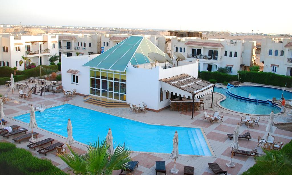 an aerial view of a resort with a swimming pool at Logaina Sharm Resort in Sharm El Sheikh