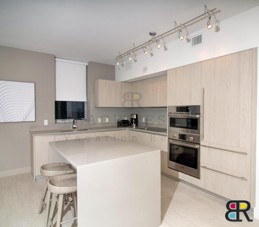 Kuchyň nebo kuchyňský kout v ubytování HYDE Beach House Apartments